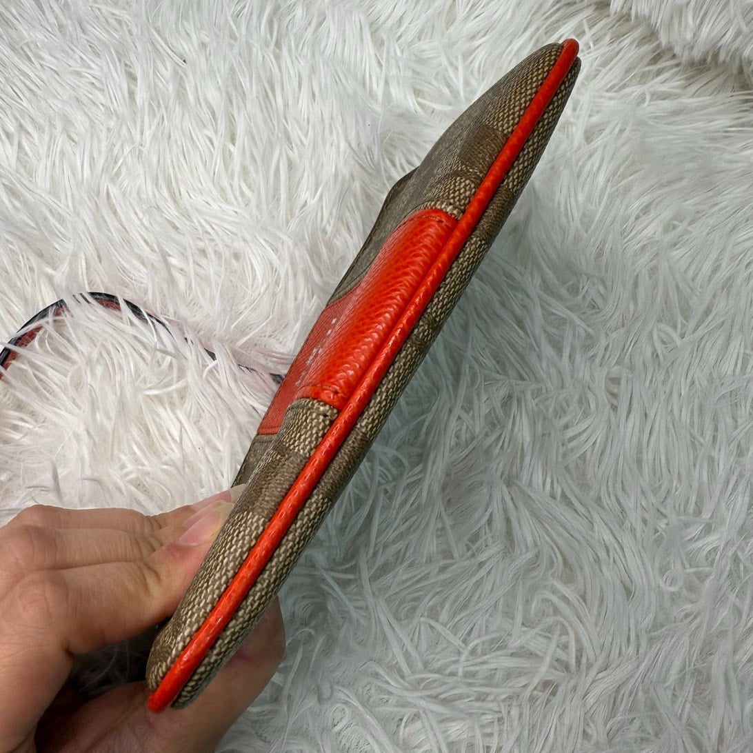 COACH Brown orange Zip Wristlet