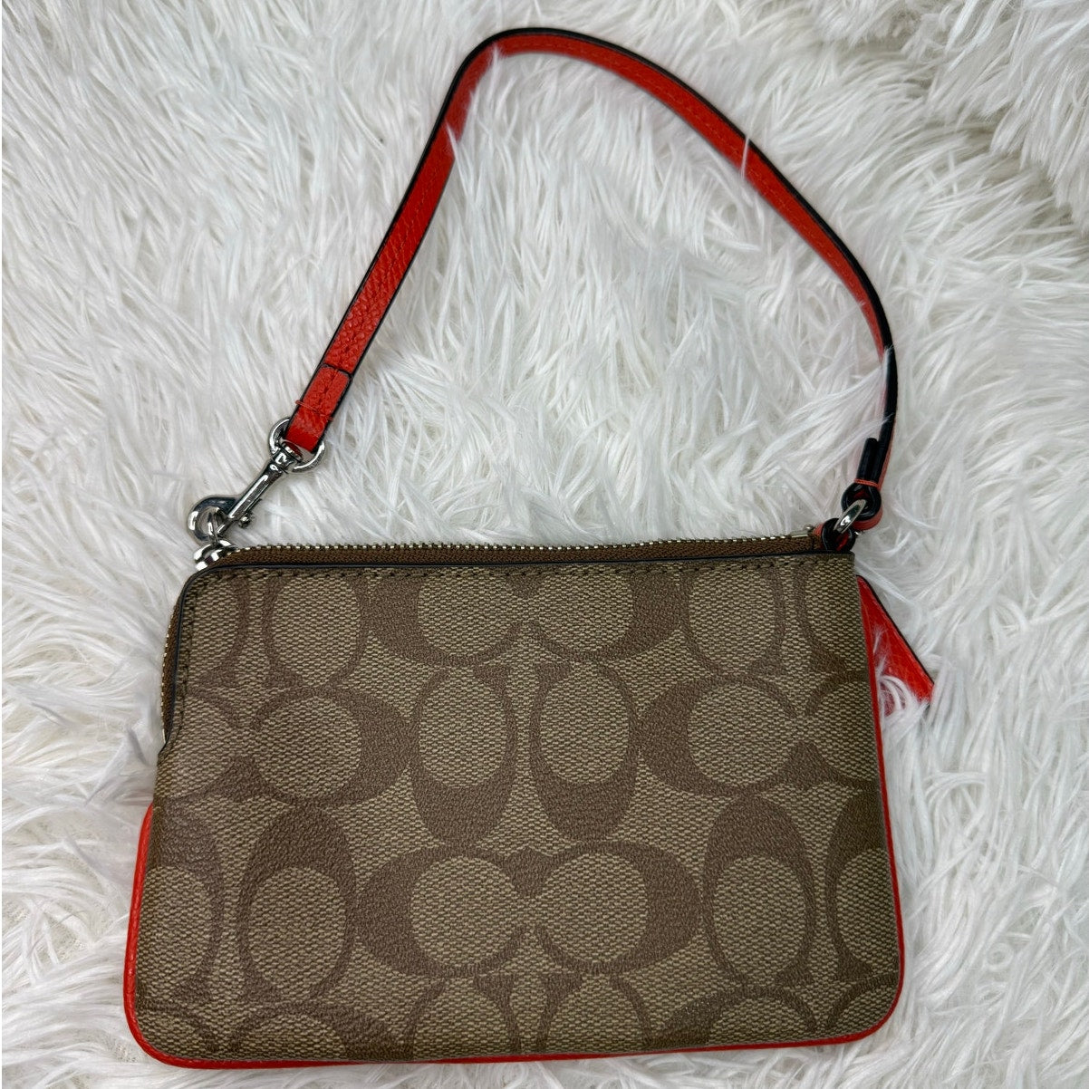COACH Brown orange Zip Wristlet