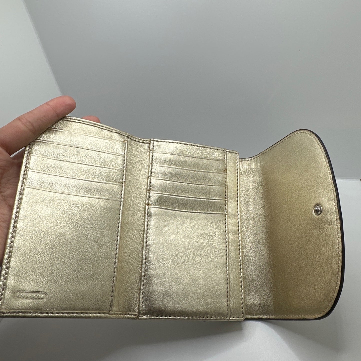 COACH Gold and off white Trifold Wallet