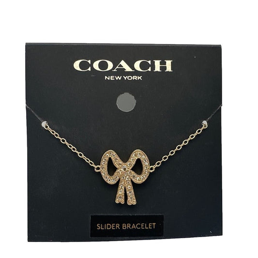 NWT Coach Pave Crystal Gold Tone Ribbon Charm Slider Bracelet