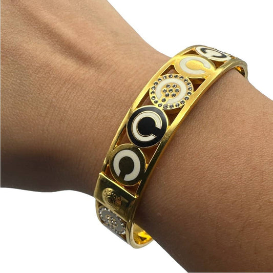 COACH HALF INCH PIERCED OP ART DISC BANGLE Bracelet