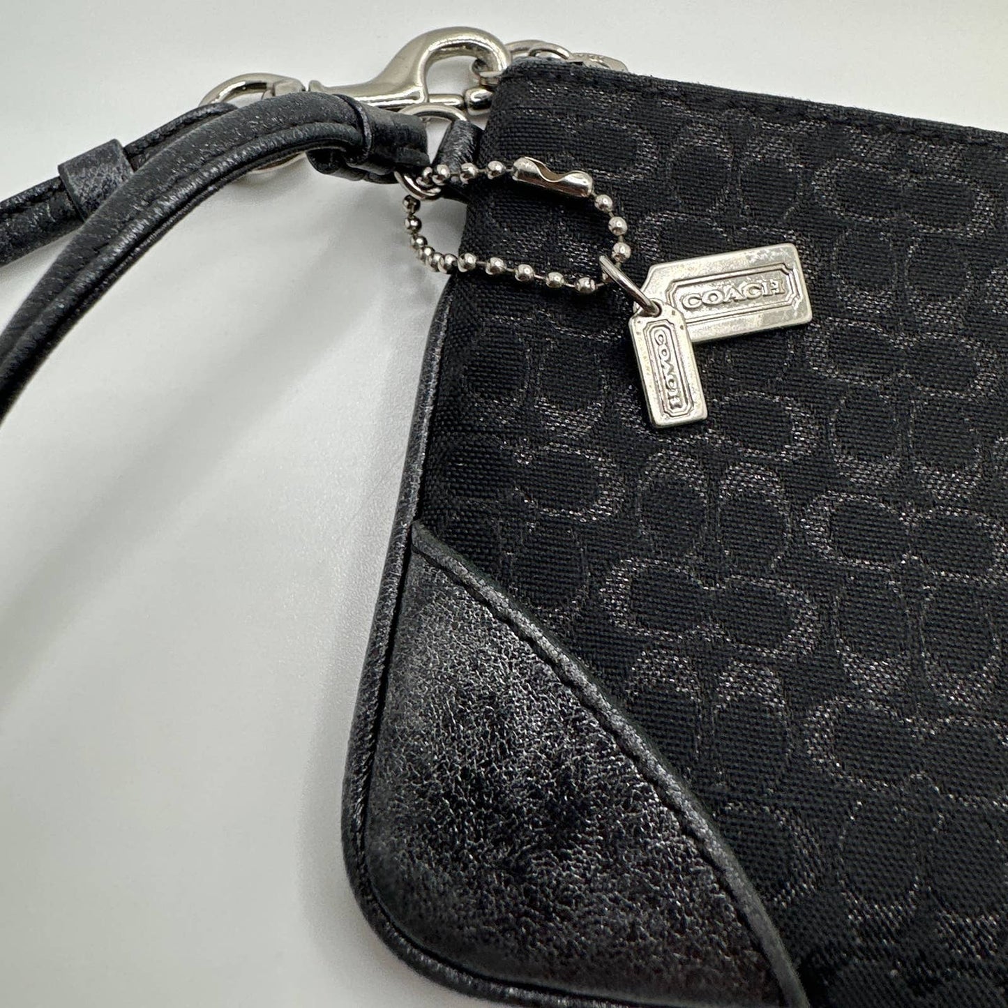 COACH Black and Silver Signature Canvas Wristlet